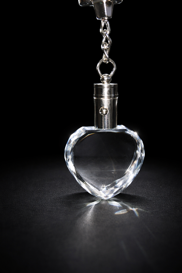 Heart-shaped crystal pendant on a black background